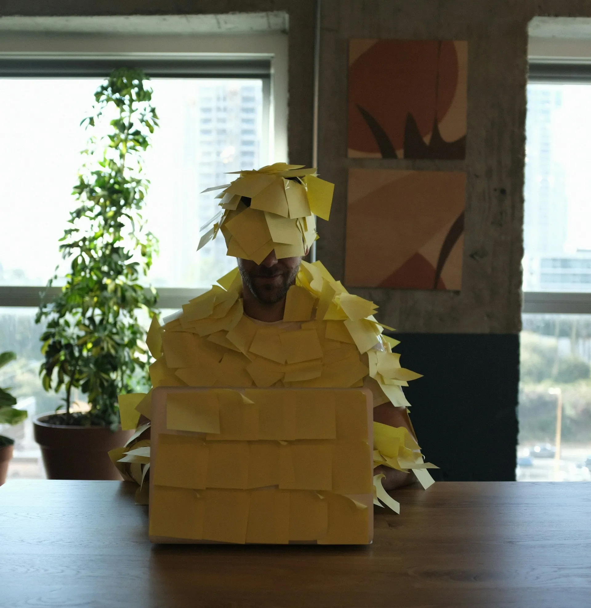 Employee with too many post-it notes.